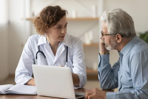 adult gerontology nurse with her patient